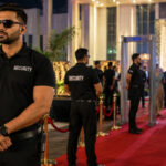 Professional security guards and bouncers managing crowd control and guest entry at a corporate event.